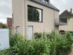 Hausansicht Garten - Modernes 1-Raum-Appartement mit Terrasse, Garten und EBK!